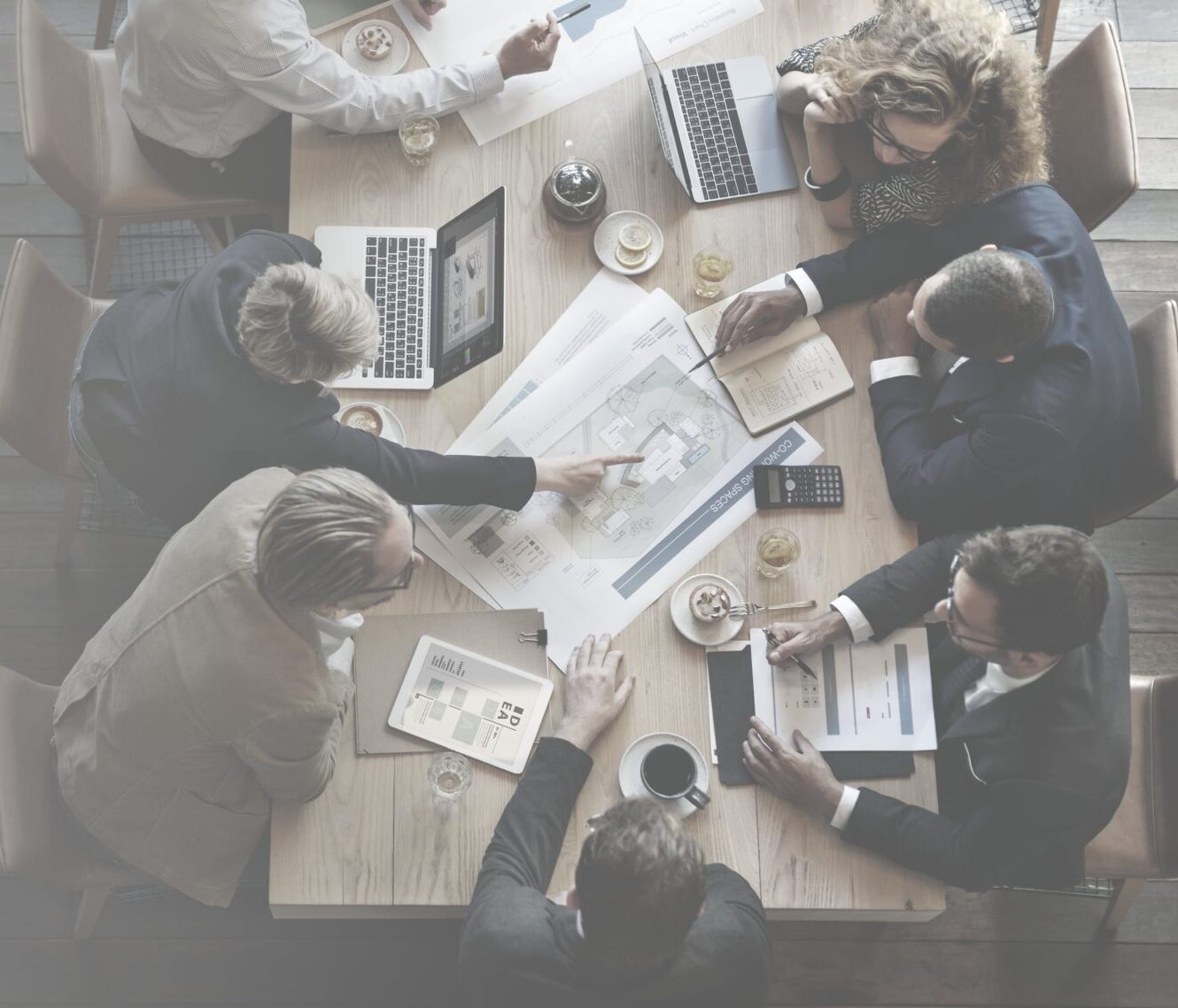 diverse-businesspeople-having-meeting-min
